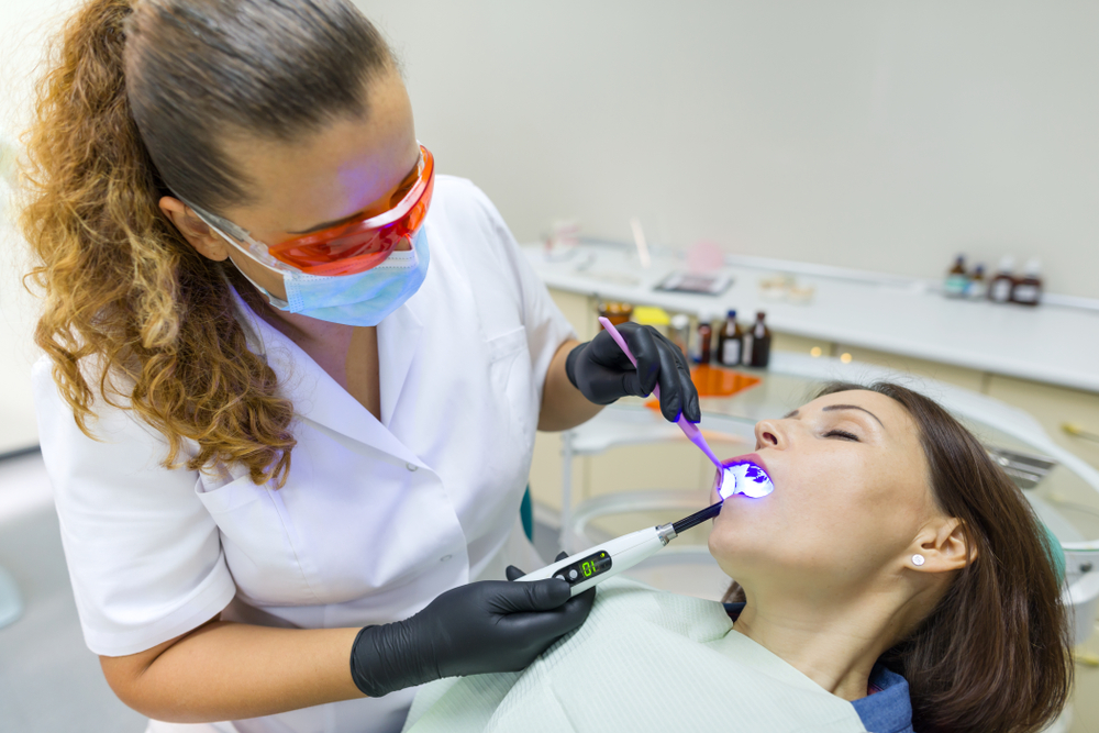 sedated patient receives dental care