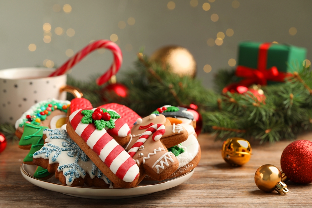 Delicious,Christmas,Cookies,On,Wooden,Table,Against,Blurred,Lights