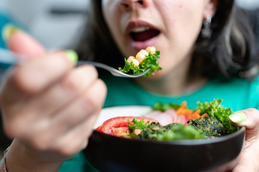 Woman,Eating,Veggie,Lunch.,Vegetarian,And,Plant,Based,Food,Concept. Woman,Eating,Veggie,Lunch.,Vegetarian,And,Plant,Based,Food,Concept.