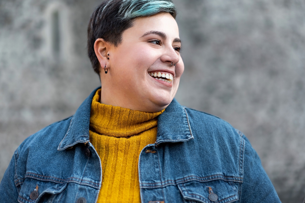 nonbinary young person smiling