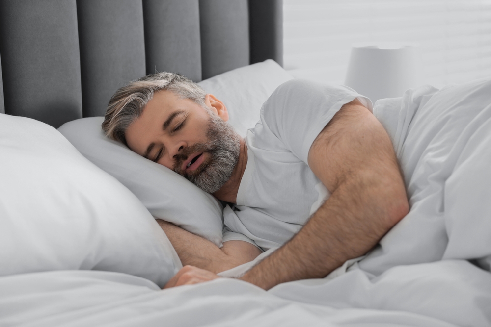 man snoring due to sleep apnea