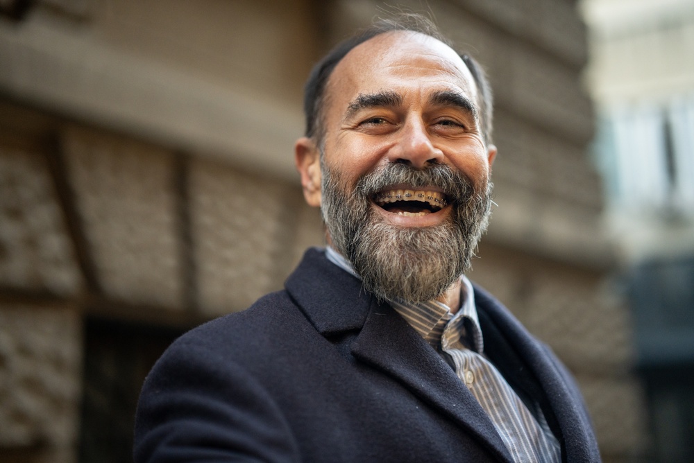 Smiling,Mature,Man,With,A,Full,Beard,Laughing,Heartily,,Showing